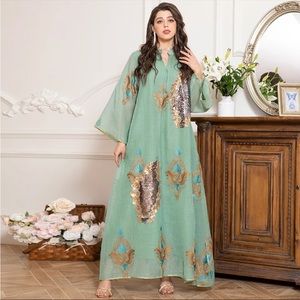 Beautiful Kaftan with embroidered touch . Some sequins adding an elegant touch